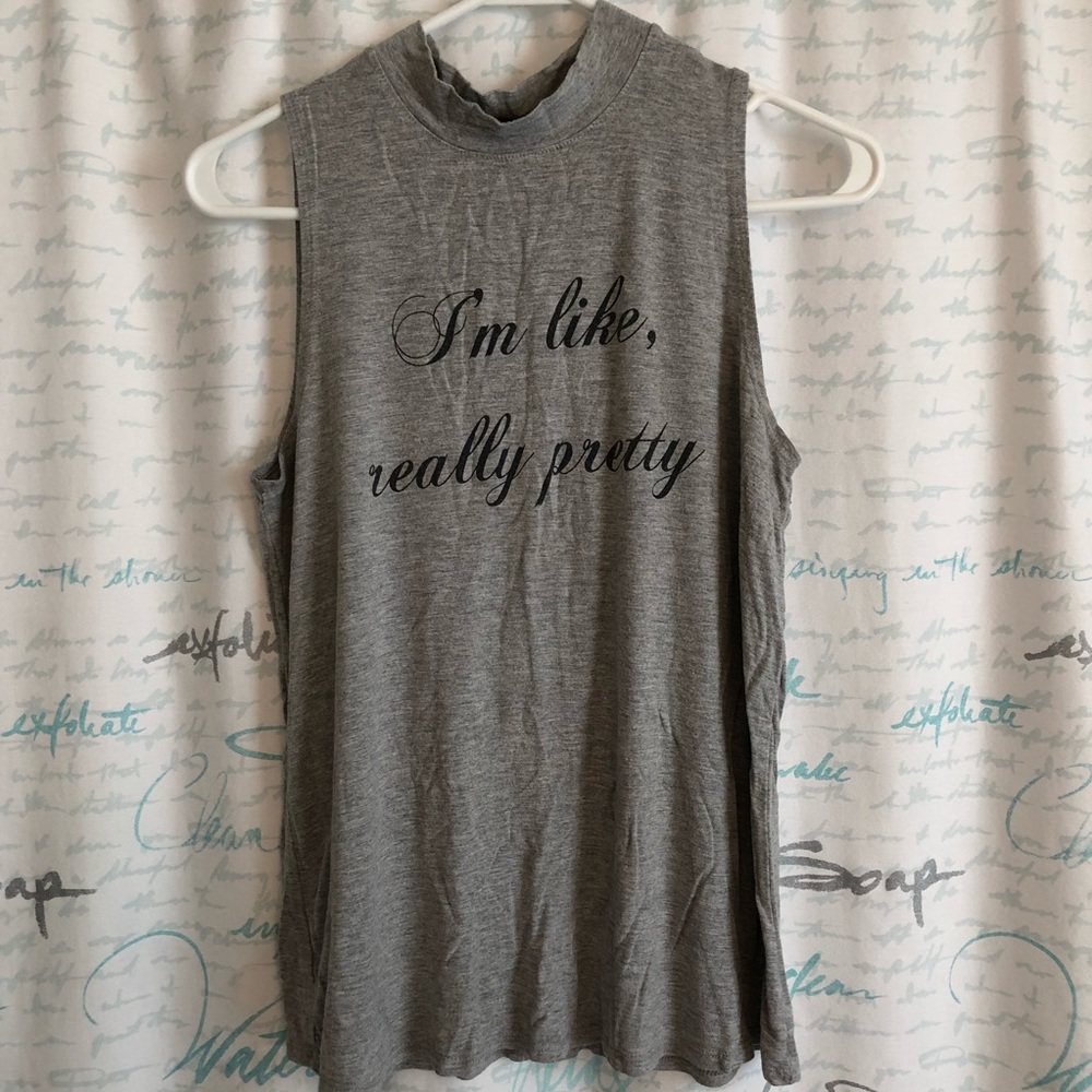 High neck, sleeveless top.